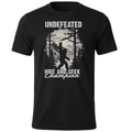 A black short-sleeve crewneck t-shirt featuring a light grey graphic print of a Bigfoot silhouette in a forest, with the text 'UNDEFEATED' above and 'HIDE AND SEEK Champion' below.
